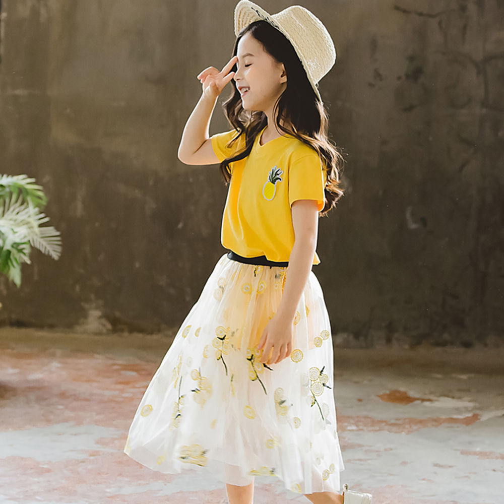 yellow top white skirt