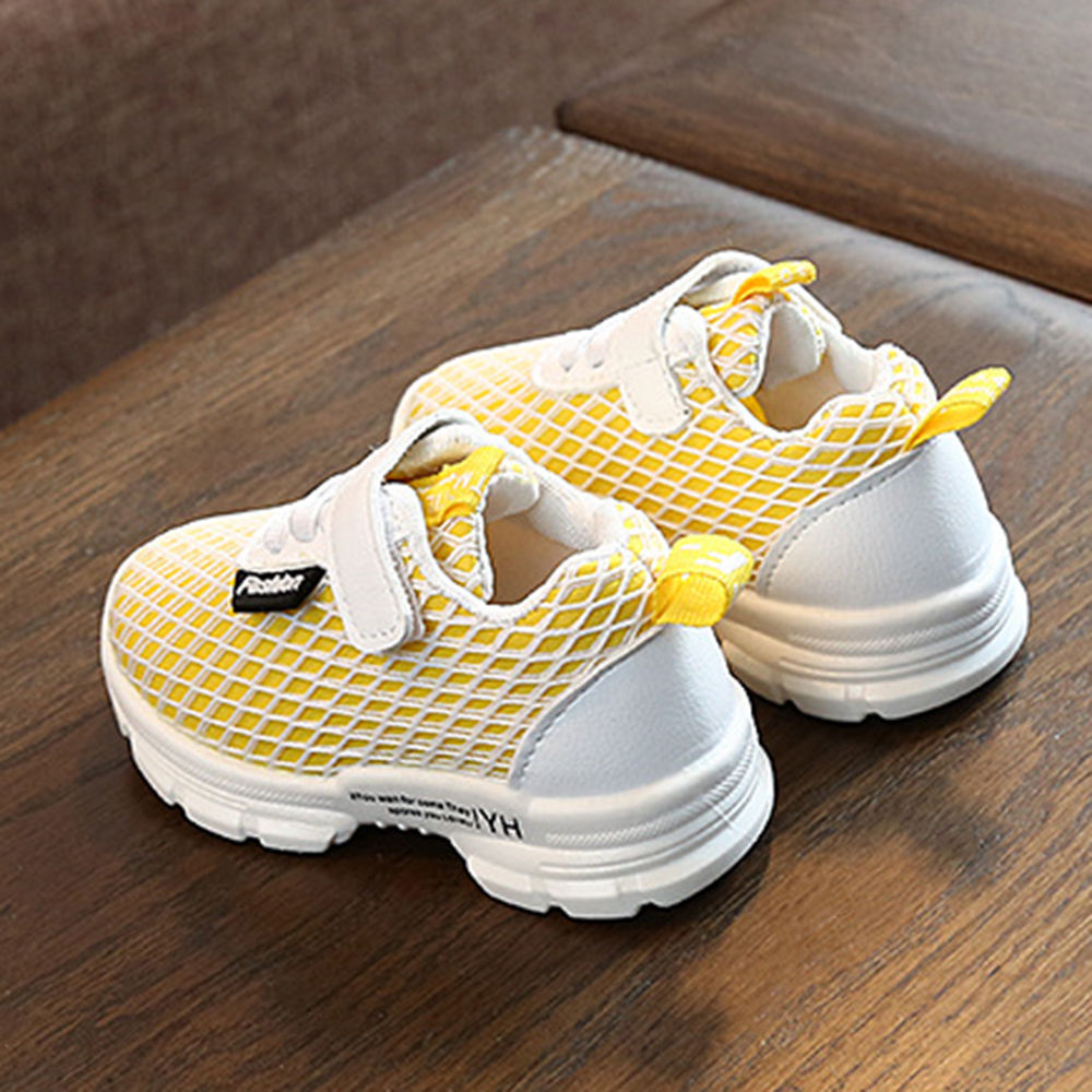 yellow velcro shoes