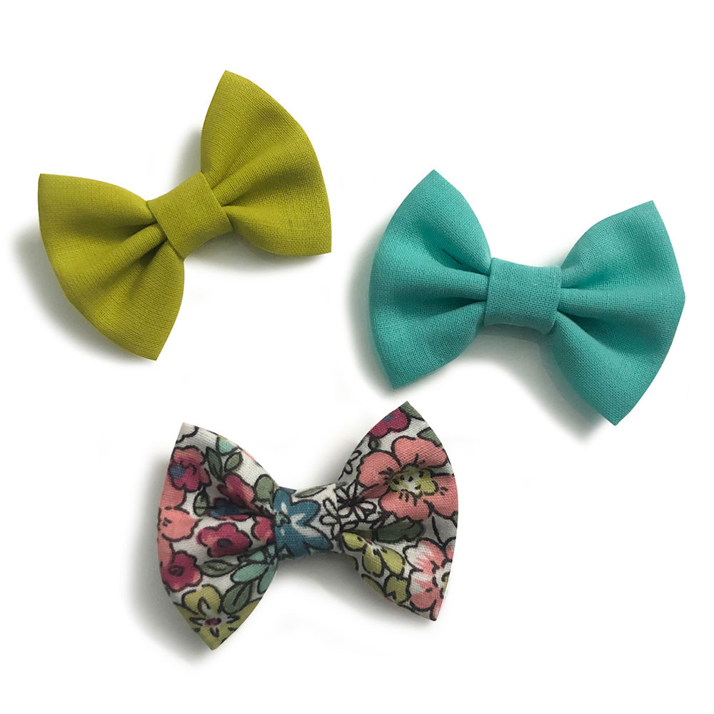 

sweet and simple handmade bows attached to an alligator clip