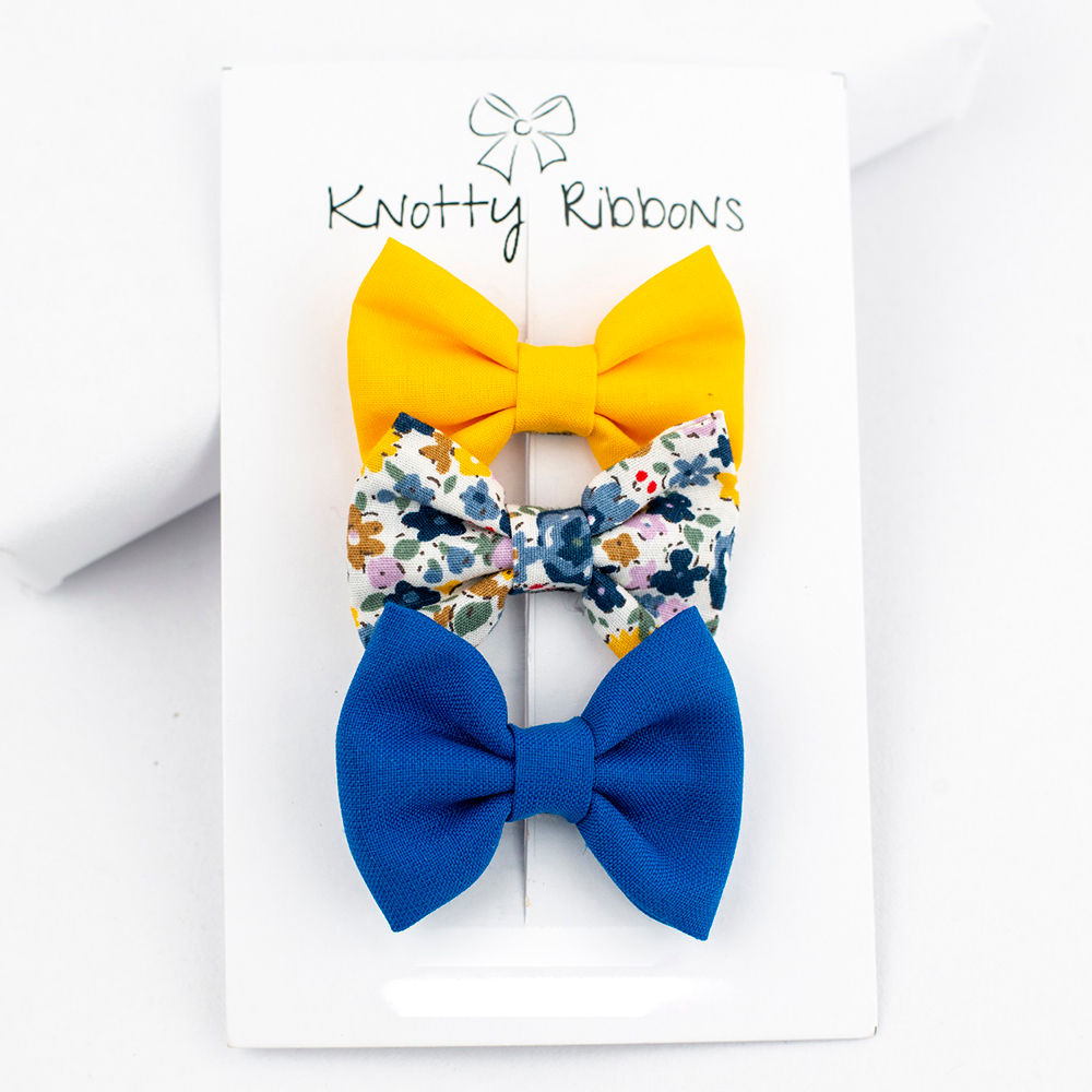 

sweet and simple handmade bows attached to an alligator clip