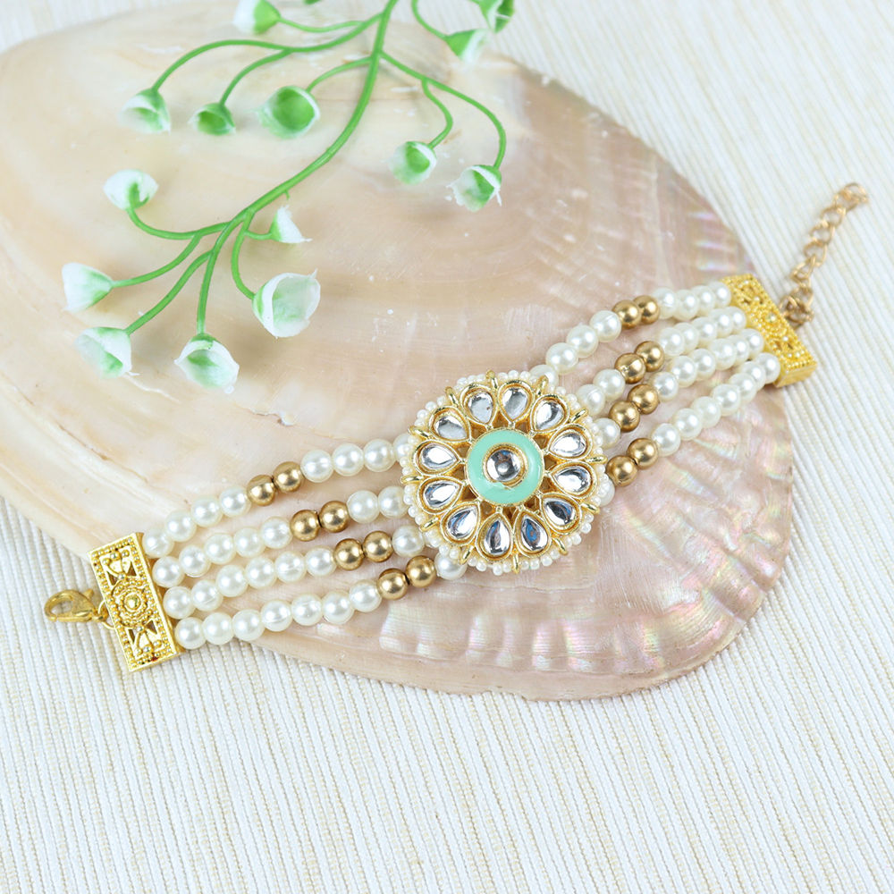 

this beaded kundan stone bracelet completes the ethnic look for