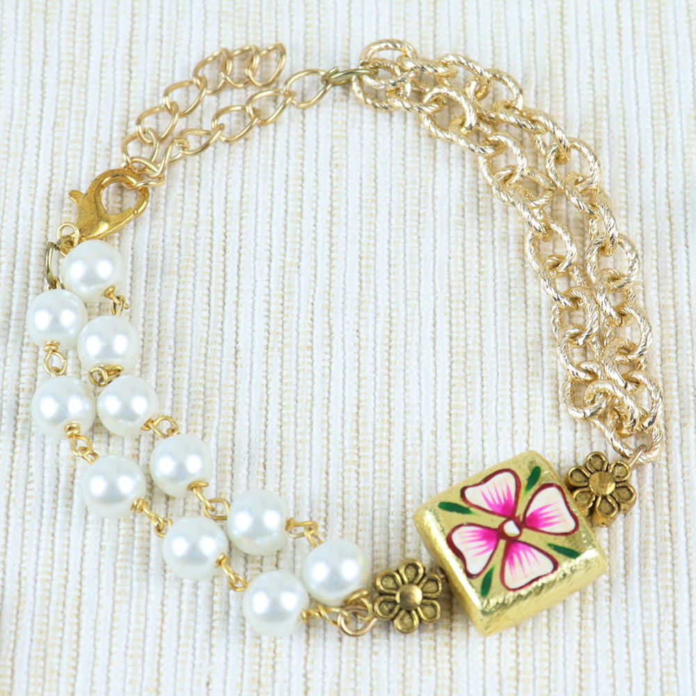 

this beaded hand painted stone bracelet completes the ethnic look