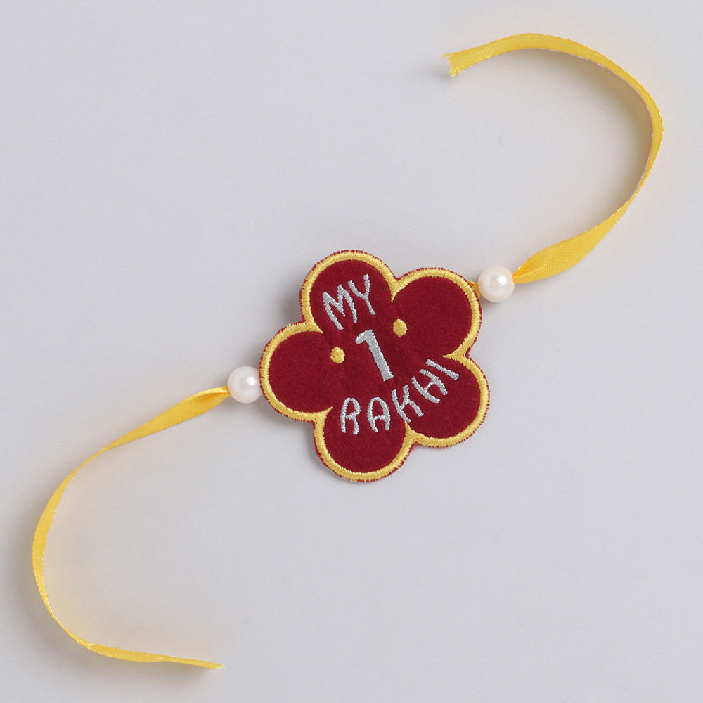 

a beautifully handcrafted red maroon floral rakhi and lumba set