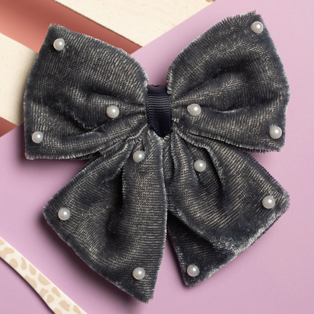 

these elegant velvet bow with pearls detailing alligator pin will