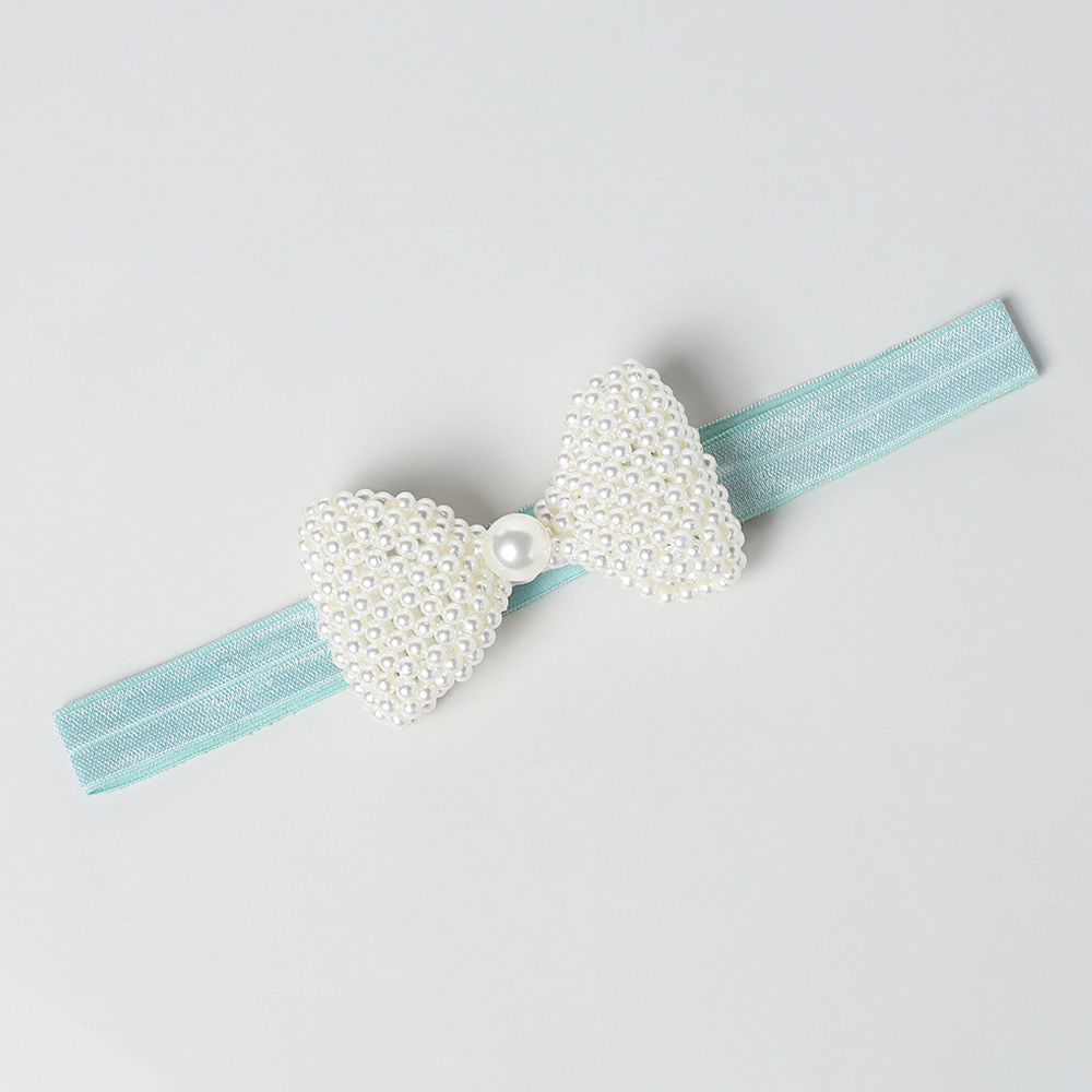 

the light blue colour of the band and pretty bow