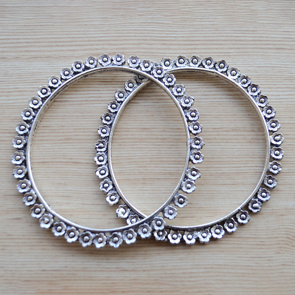 

pair of traditional bangles with flower pattern vintage inspired