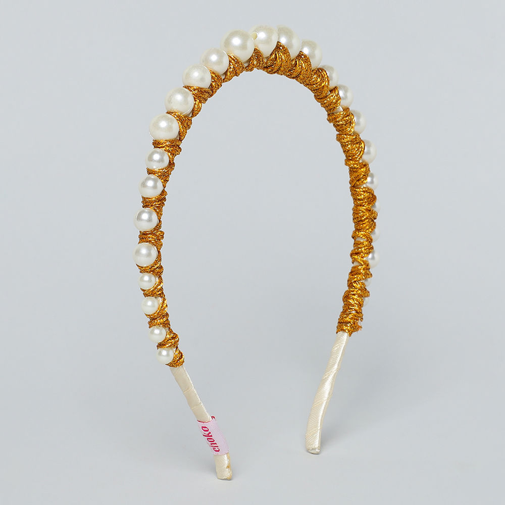

the background beige shade inlaid with dainty pearls in a
