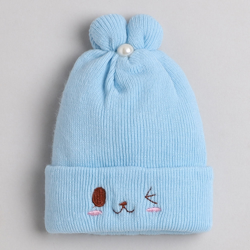 

dinosaur beanie lined with velvet fleece covering baby s face