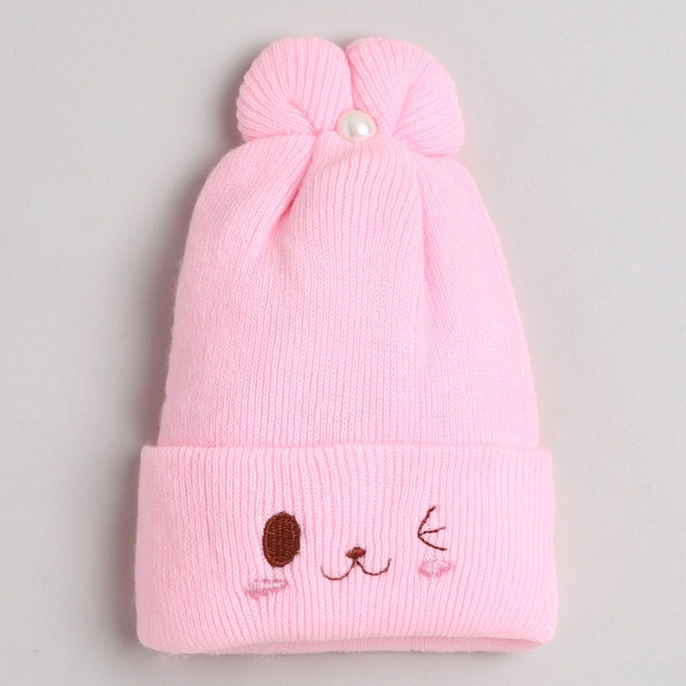 

dinosaur beanie lined with velvet fleece covering baby s face