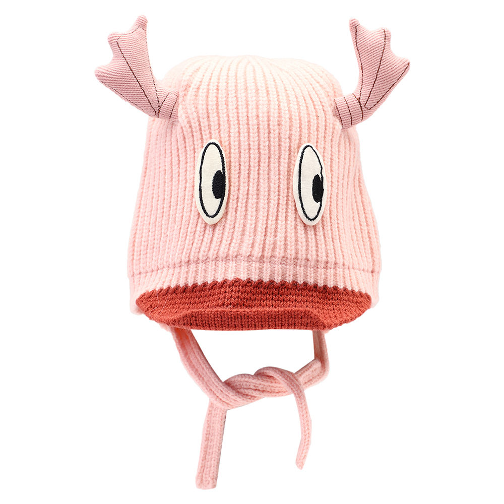 

dinosaur beanie lined with velvet fleece covering baby s face