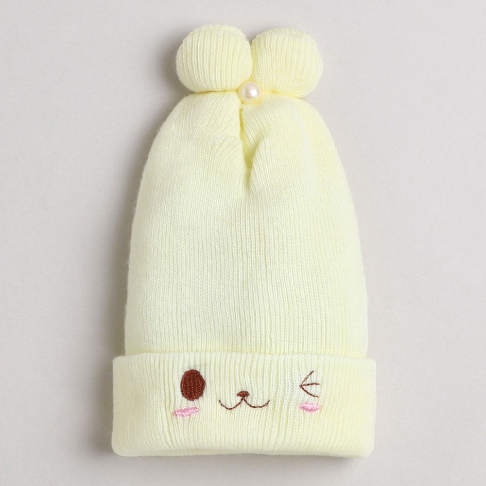 

dinosaur beanie lined with velvet fleece covering baby s face